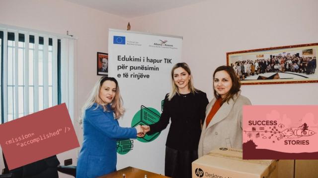 Three women at a computer handover, two shaking hands in front of an EU-funded project banner